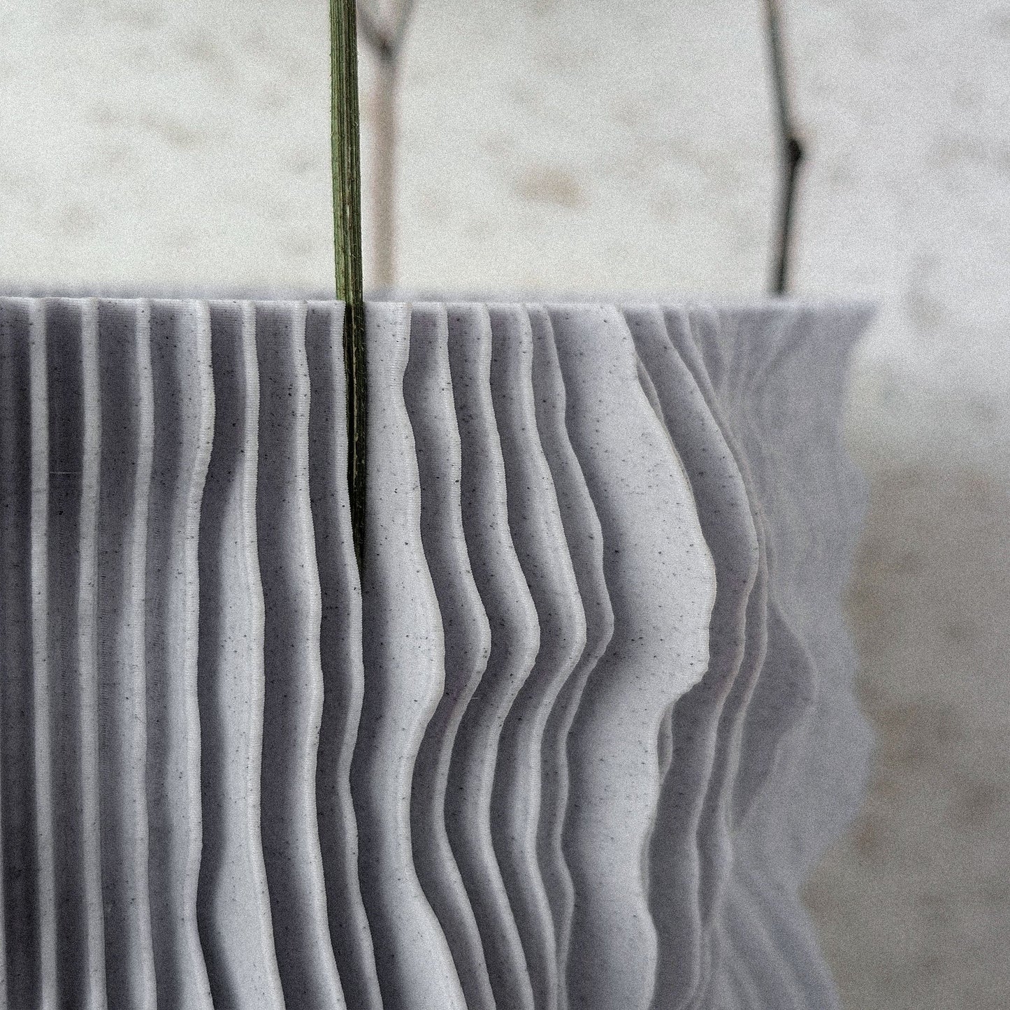 Side silhouette of PROFILUM Lamp casting layered shadows on a concrete wall