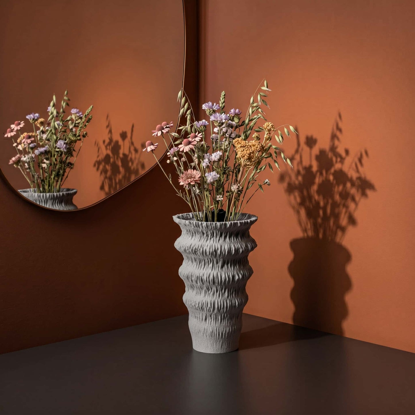 Fluvia vase in a lifestyle picture on a table at home