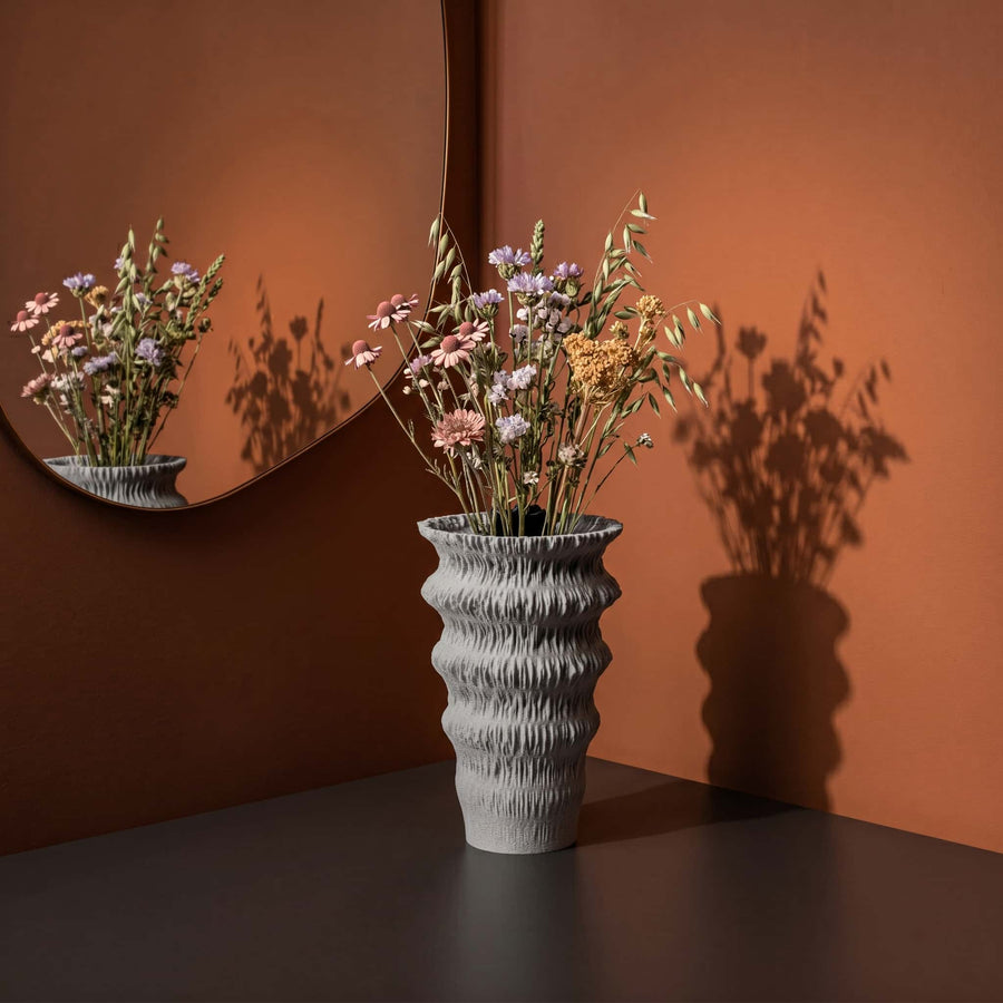 Fluvia vase in a lifestyle picture on a table at home